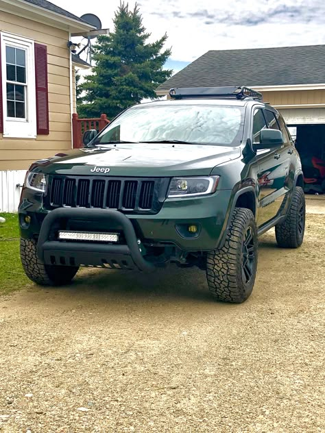 2011 Jeep Grand Cherokee WK2 3.6L 4x4. Dark Forrest Green. Bull bar, Rocky Road lift kit, 265/65R18 Falken Wildpeak, Cargo Roof Basket, Black MB TKO 18x9-0 offset wheels, Wilco Tiregate. Dark Green Jeep, Grand Cherokee Lifted, Jeep Compass Trailhawk, Jeep Grand Cherokee Accessories, Jeep Wk, Jeep Srt8, Jeep Cherokee Trailhawk, Jeep Wj, Jeep Camping