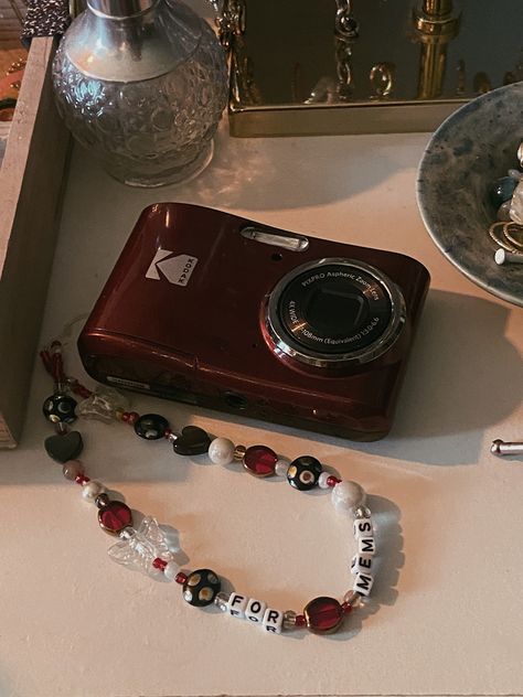 Diy Photo Necklace, Camcorder Decorated, Digital Camera Charm Strap, Decorated Polaroid Camera, Red Digital Camera Aesthetic, Digital Camera Charm, Camera Decor Ideas, Cute Camera Strap, Camera Charm Strap