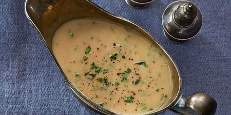 Sweet Onion & Herb Gravy Recipe - Country Living Easy Thanksgiving Gravy, Cranberry Gravy, Thanksgiving Gravy Recipes, Herb Gravy, Easy Gravy Recipe, Thanksgiving Gravy, Holiday Entertaining Food, How To Thicken Sauce, Homemade Gravy