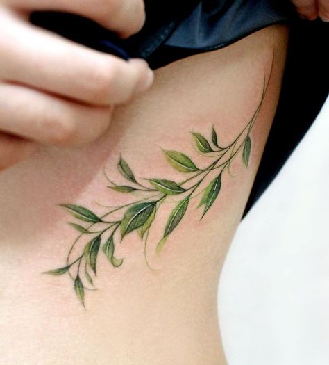 90+ Side Rib Tattoos for Women: Top Trends and Ideas for 2023 - 100 Tattoos Side Rib Tattoos, Tattoos On Side Ribs, Green Tattoos, Rib Tattoos For Women, Vine Tattoos, Plant Tattoo, Geniale Tattoos, Botanical Tattoo, Elegant Tattoos