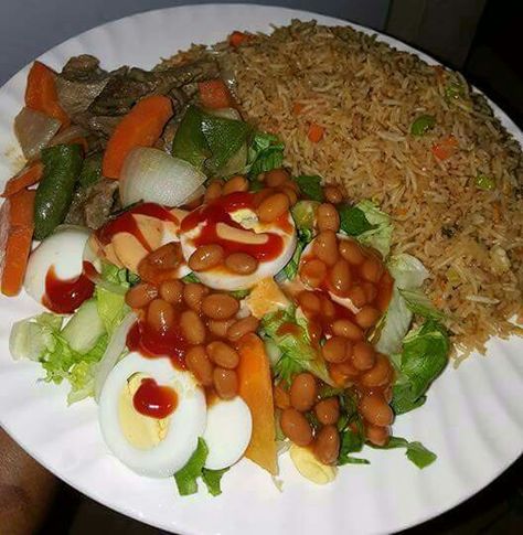 Local fried rice and salad Rice And Salad, Nigeria Food, Ghanaian Food, African Recipes Nigerian Food, Rice Side Dish Recipes, Homemade Comfort Food, Foods For Healthy Skin, West African Food, Nigerian Recipes