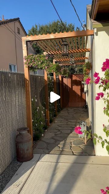 Carolina on Instagram: "Finally finished the walkway guys! I am so in love with the results👨🏽‍🌾♥️👩🏽‍🌾 . . #walkway #jardin #pasillo #home #homedesign #renovation #homeplants #plants #mexico #patio #curbappeal #california #señora #relatable #casa #hogar #home #mexicandesign #explore #trending #ighome #autumn #fall #october #hangingplants #flower #flores #cantaritos #mexicancourtyard #courtyardgarden #landscape" Garden Alley Ideas, Spanish Front Yard Landscape, Mexican Backyard Decor, Spanish Courtyard Ideas, Mexican Garden Hacienda Style, Patio Mexicano, Mexican Courtyard, Spanish Courtyard, Mexican Garden