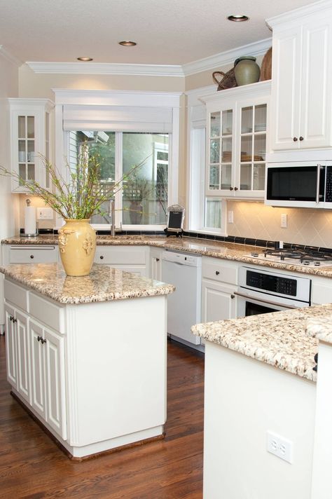 White Cabinets Cream Tile Backsplash Giallo Fiesta Granite Countertops Dark Hardwood Floors Alder Kitchen Cabinets, Repainting Kitchen Cabinets, Granite Countertops Colors, White Kitchen Appliances, Amazing Kitchens, Rental Ideas, Flip House, Kitchen Makeovers, Outdoor Kitchen Appliances