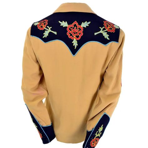 For Sale on 1stDibs - This vintage gold wool gabardine western shirt was made by Vaquero Fashions. The shirt snaps up the front and has blue trim and embroidered flowers. We Embroidered Western Shirt, Western Style Long Sleeve Embroidered Shirt, Western Long Sleeve Embroidered Shirt, Vintage Embroidered Button-up Shirt, Vintage Embroidered Collared Blouse, 1970 Fashion, Native American Print, Hooded Tunic, Printed Silk Shirt