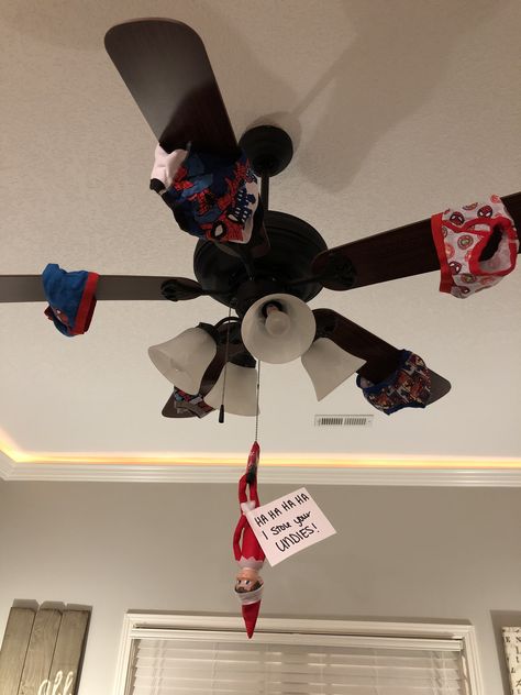 Elf On A Shelf Ceiling Fan, Elf On Ceiling Fan, Elf Swinging From Ceiling Fan, Elf Ceiling Fan, Ceiling Fan Elf On The Shelf, Elf On The Shelf Fan Ceilings, Elf On Fan, Elf Hanging From Ceiling Fan, Elf On The Shelf Ceiling Fan