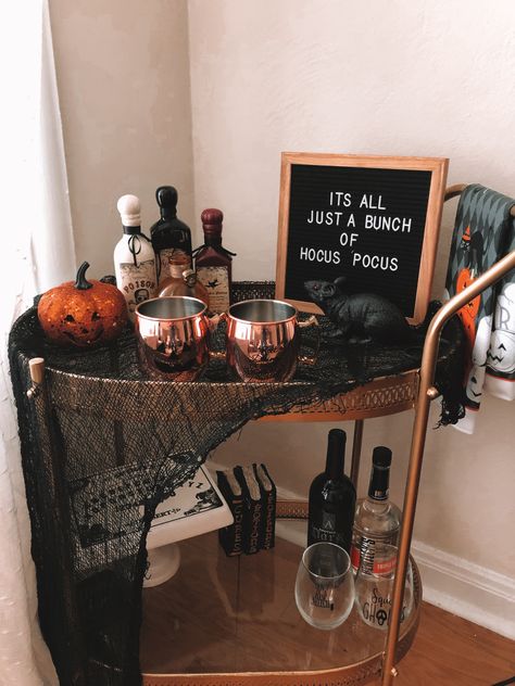 Spooky, affordable DIY Halloween bar cart for small apartments! Bar Cart Apartment Small Spaces, Spooky Bar Cart, Halloween Bar Cart Decor, Beverage Cart Decor, Diy Small Bar, Small Halloween Party, Halloween Bar Cart, Holiday Bar Cart, Office Halloween Decorations