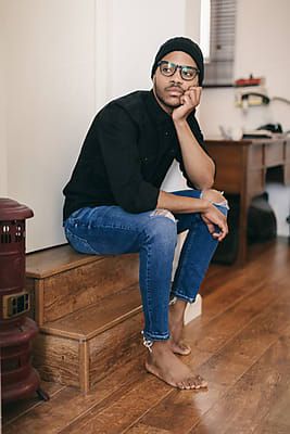 Man Sitting On Stairs, Man Living Room, Sitting On Stairs, Latin Men, Man Portrait, Living Room Photos, Man Sitting, Sitting Poses, Boy Poses