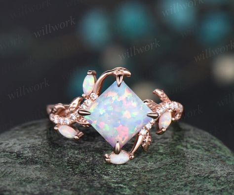 This ring is handmade by myself. The main stone is a 7x7mm princess lab opal. The accent stones are lab opals and diamonds or moissanites. The band width is about 1.4mm. The material is solid 14k gold(white,yellow,rose gold is also available) Ring size can be choose from the selection box. This jewelry can also be made in solid 10k,14k,18k gold,with real diamonds.Contact me! Need rush order? contact me! Need custom making order? Contact me! I have confidence on my jewelry.30 days money back guarantee!(For returned item,as this is handmade jewelry.Handcrafted fee and shipping fee will be deducted,others will be refunded soon) Thanks for your visiting! Trillion Engagement Ring, White Opal Engagement Ring, Opal Engagement Ring Rose Gold, Vintage Opal Engagement Ring, Rose Gold Leaf, Moissanite Ring Set, Opal Engagement Ring, Rutilated Quartz Ring, Engagement Ring Rose Gold