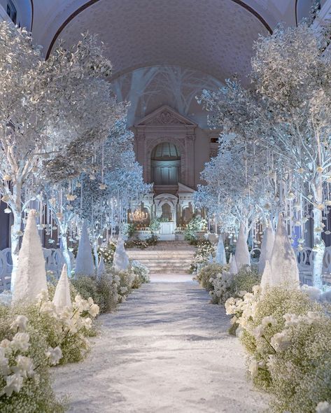 Fairytale wedding ceremony filled with dreamy floral designs in an all-white theme | wedding, wedding inspo, wedding decor ideas, wedding theme ideas, fairytale wedding, indoor wedding decor, wedding ceremony decor, wedding ceremony ideas, wedding aisle decor, wedding aisle ideas, winter wedding, winter wedding decor, wedding flowers, wedding flower arrangements, wedding floral designs, event floral design, white wedding, winter wedding theme #weddingceremony #wedding Winter Wonderland Wedding Aesthetic, White Aesthetic Wedding Decor, Indoor Fairytale Wedding, Glass Floor Wedding Aisle, Winter Wedding Isles, Winter Ballroom Wedding, White Christmas Wedding Decorations, Ethereal Winter Wedding, Heaven On Earth Wedding Theme