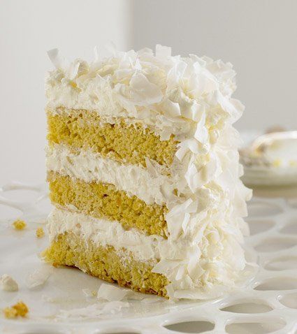 This is one of my favorite cakes from my book. It reminds me of ballerina in a giant white tutu — completely over the top. When I was developing the recipe, the idea was to create a big white confection that wasn't overly sweet and capitalized on the flavor and texture of freshly shaved coconut. Using the pre-shredded stuff in the plastic bag gives an inferior result. If packaged coconut is your only choice, be sure to avoid the sweetened variety. Coconut Mousse, A Slice Of Cake, Mousse Cake Recipe, Slice Of Cake, Baking Goods, Fresh Coconut, A Piece Of Cake, Coconut Cake, Piece Of Cake