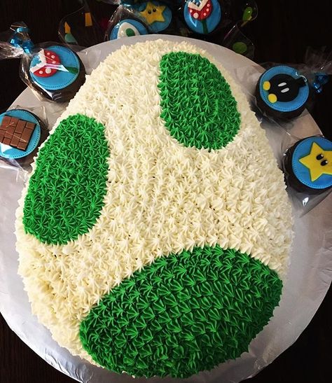 Yoshi egg cake... Chocolate cake filling with @nutella and decorated with vanilla buttercream #mariobrosparty #birhdayboy #chambersburg… Yoshi Egg Cake, Yoshi Cupcakes, Chocolate Cake Filling, Yoshi Cake, Yoshi Party, Luigi Party, Nintendo Cake, Chocolate Filling For Cake, Yoshi Egg