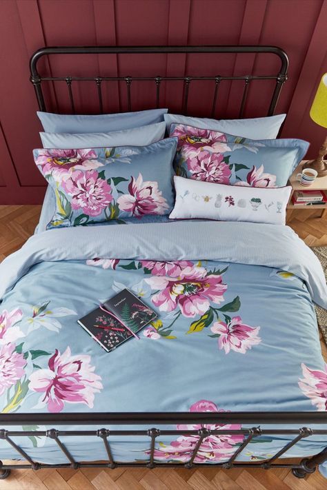 Snuggle down into countryside comfort with this beautiful bedding set. The floral print will bring traditional country living into your bedroom while the hand-drawn flowers have been offset against a lovely blue background. The reverse is a simple vertical stripe and both the duvet and pillowcases have vibrant purple piping. #bedcover #beddingset #bedroomdecor #luxurybedding #duvet #beddingsets #duvetcover #bedlinen #Floral Beautiful Bedding Sets, Super King Duvet Covers, Double Duvet Covers, Floral Bedding, Single Duvet Cover, Vibrant Purple, Bed Sets, Garden Bedding, Cotton Duvet Cover