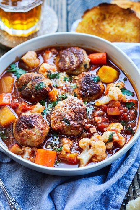 Loving healthy, comfort food with this turkey meatball soup recipe! A spicy, one-pot meal of tomato-based soup loaded with tender turkey meatballs, butternut squash, carrots and cauliflower. An easy and flavorful meatball soup recipe the whole family will enjoy! Meatball Stew Recipe, Soup One Pot, Frozen Turkey Meatballs, Turkey Meatball Soup, Turkey Meatballs Healthy, Healthy Meatballs, Meatball Stew, Spicy Turkey, Meatball Soup Recipes