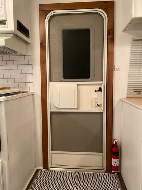 Rv Door Frame Makeover, Trim Around Camper Door, Painting Rv Window Frames, Rv Door Remodel, Rv Door Trim, Rv Door Makeover, Camper Door Makeover, Rv Living Room, Camper Windows