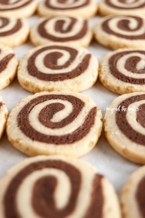 Chocolate Pinwheel Cookies are perfect to make over the holidays! They're a combination of chocolate cookie dough and vanilla cookie dough rolled together into a beautiful swirl, then rolled in demerara sugar for a bit of sweet crunchiness on the outside! They taste fantastic and a definite must make! | Recipe over on www.BeyondtheButter.com | #holidaycookies #pinwheelcookies #cookies #beyondthebutter Pinwheel Cookie Recipes, Chocolate Pinwheel Cookies, Vanilla Cookie Dough, Holidays Treats, Pinwheel Cookies Recipe, Swirl Cookies, Demerara Sugar, Icebox Cookies, Pinwheel Cookies