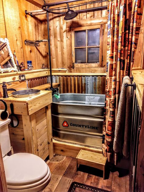 Off Grid Cabin Bathroom Ideas, Stock Tank Shower Ideas, Old West Bathroom, Rustic Bathtub Ideas, Campground Bathhouse Ideas, Rustic Bathroom Ideas With Tin, Tin Shower Walls Rustic Bathrooms, Small Cabin Bathroom Ideas, Tin In Shower Rustic Bathrooms