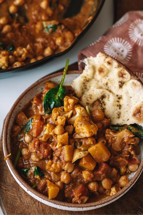 Sweet, earthy pumpkin and nutty cauliflower combine in this fragrant, soul-hugging Pumpkin Cauliflower Curry. A warm and nourishing fall stew made with coconut milk, chickpeas, and spinach. Fall Stew, Pumpkin Cauliflower, Chickpeas And Spinach, Pumpkin Stew, Pumpkin Curry, Cauliflower Curry, Fall Dishes, Vegan Curry, Vegetable Curry