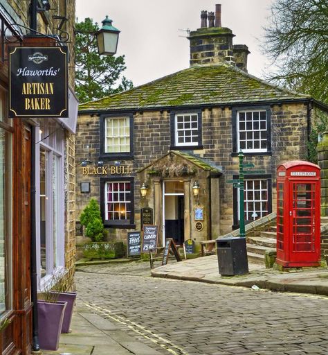 The Black Bull pub in Haworth village, West Yorkshire. Known for its association with the Brontë sisters, the village name is thought to mean "hedged enclosure". Red Telephone, British Pub, Oxford England, English Village, Black Bull, England And Scotland, English Cottage, England Uk, English Countryside