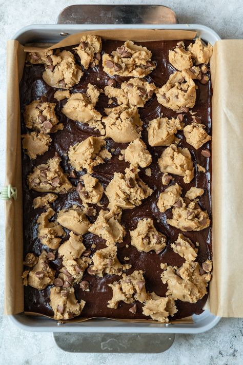 These brookies are made with an easy chocolate chip cookie dough thats dolloped on top of a one bowl batter brownie recipe. The result is a thick, chewy, and fudgy brookie that has crispy edges and a chewy center. This 9x13 dessert is easy for beginning bakers or anyone who can't decide between having chocolate chip cookies or brownies for dessert Brownie With Chocolate Chip Cookie, Brownie Cookie Bar, Brookies Recipe Cookie Brownies With Box Brownies, Brookies Recipes Easy, Chocolate Chip Brownie Bars, Cookie Brownies Recipe, Brown Butter Brookies, Refrigerated Cookie Dough Recipes, Brownie With Cookie Dough