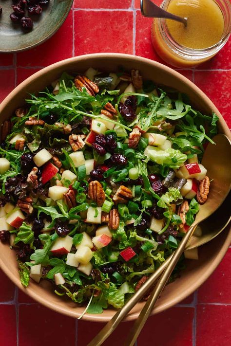 A bold salad with arugula, crisp apples, sweet dried cranberries, pecans and scallions, tossed in a five-ingredient apple cider dressing. Arugula Apple Salad, Arugula Salad Dressing, Apple Cider Dressing, Apple Salad Recipes, Holiday Appetizers Recipes, Pecan Salad, Cranberry Salad, Dishes To Make, Apple Salad