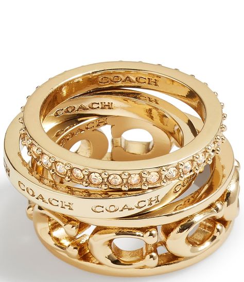 From COACH, this ring set features:Band ring setBrass/Glass CrystalSlip-on Signature sculpted C motif, engraved logo, and minimal paveApprox. 0.1" - 0.3" ring face lengthApprox. 2mm - 8mm ring band widthApprox. 17mm ring band diameterSet includes 3 rings to mix and matchIncludes COACH pouchImported. Dope Jewelry Accessories, Luxe Jewelry, Stacking Ring Set, Jewelry Accessories Ideas, Dope Jewelry, Girly Accessories, Jewelry Fashion Trends, Jewelry Essentials, Jewelry Lookbook