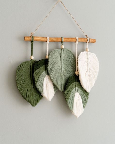 Our Macrame Leaves Decor is the perfect choice for adding a touch of charm to any space. Whether it's for a housewarming, a wedding, or simply to brighten up your own home, this neutral wall art featuring green leaves is a fantastic addition. 🌿 👉 Check out more at https://beandaikon.com/products/macrame-leaves-wall-hanging-for-tropical-farmhouse-decor or contact us directly! #UniqueHomeDecor #GiftIdeas #DecorInspiration #HandmadeWithLove #BohoLiving #CreativeGifts #EcoFriendlyDecor #EtsyHan... Nursery Mid Century Modern, Nursery Mid Century, Spa Wall Decor, Hanging Greenery, Leaf Wall Hanging, Simpul Makrame, Macrame Leaf, Jungle Nursery Decor, Macrame Wall Hanger