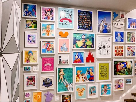 Disney Lithographs Display, Disney Wall Collage Ideas, Disney Wall Collage, Disney World Room, Modern Disney Decor, Disney Inspired Playroom, Disney Photo Wall Display, Disney Gallery Wall Ideas, Disney World Themed Bedroom