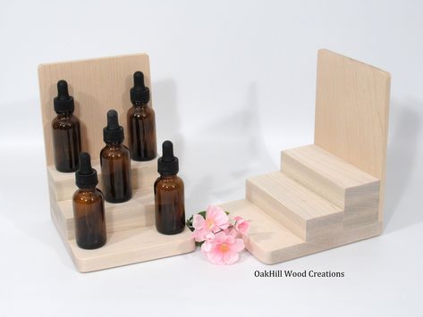 "Bottle Display, Product Display Stand, Essential Oil Display. This 3 Tier Display Stand showcases 1 Oz. bottles of product, such as Perfume, Essential Oils or Beard Care Products. Our Stand is ideal for placement on your display table or as a riser to add height to an otherwise straight & in-line display. On a shelf, place one at each end to add depth and height to your products. Dimensions: 5.12\"W x 5.87\"D x 7.25\"H 1.87\" Depth of Steps 1\" Risers, 2nd & 3rd Steps * Solid American M Beauty Product Display, Craft Fair Display Table, Market Stall Display Ideas, Cosmetics Display Stand, Diy Serum, Organic Perfume, Craft Booth Display, Craft Market Display, Vendor Displays