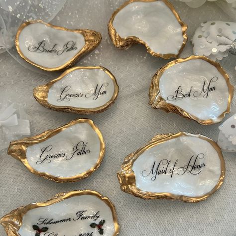 Oyster Shell Place Cards, Wedding Place Cards, Oyster Place Cards, Oyster Wedding Favor, Wedding Place cards, Wedding Decor, Pearl Wedding Handmade gifts for all of life’s special occasions. Shop on our Etsy link below https://www.etsy.com/shop/tidesoftimedesigns Custom Oyster Shell Mother of The Bride with Wedding Date - Thoughtful Gift for the Moms - Mother of the Groom - Step Mom, bridesmaids, bridal party, wedding rehearsal dinner guests, and more. ❤️Thank you for looking and hope we... Shell Name Places, Seashell Name Cards, Oyster Place Cards Weddings, Oyster Themed Party, Oyster Wedding Decor, Oyster Name Cards, Oyster Shell Place Cards, Oyster Wedding, Shell Place Cards