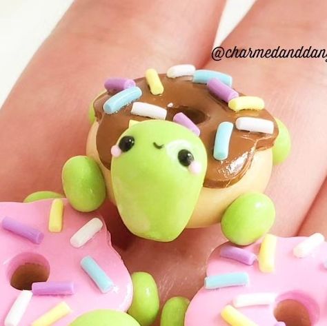 CharmedandDangerous on Instagram: "Happy Donut Day! Throwback to these 2020 donut turtles. I plan to make these again soon.🍩🐢 #nationaldonutday . . . . . . #turtles #donutoftheday #donutlover #donutday #donutdecorating #turtlesofinstagram #claycreations #kawaiiclay #claysculpting #clayartist #createdaily #makersofinstagram #turtlelover #cutecrafts #donutmaker #fulltimeartist #polymerclay #polyart #kawaiicharm #claymaker #clayminiature #knitandcrochet #fibercommunity" Donut Polymer Clay, Clay Donut, Polymer Clay Turtle, Clay Turtle, Clay Kawaii, Fimo Ideas, Donut Day, Donut Maker, Clay Inspo