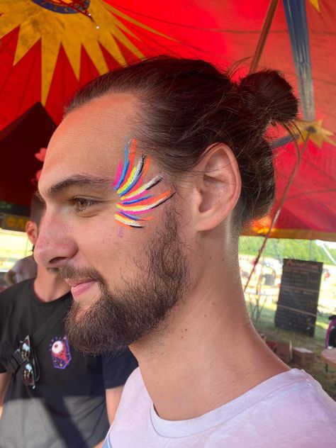 Uv Festival Makeup, Simple Festival Face Paint, Face Painting Cochella, Facial Makeup Art, Mens Festival Makeup, Pride Body Painting, Festival Makeup For Men, Easy Neon Face Paint Ideas, Concert Face Paint