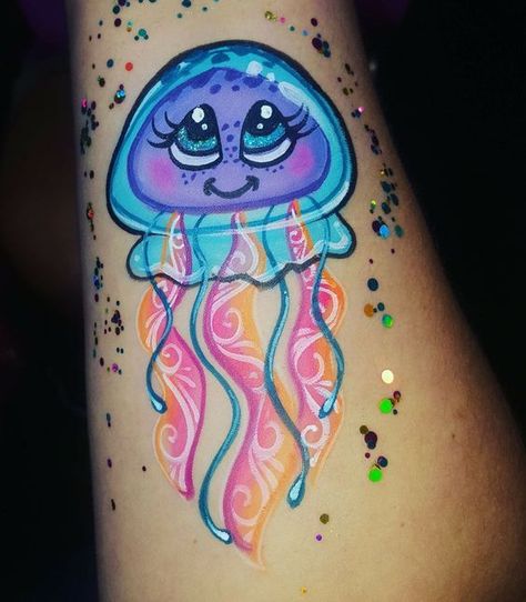 Discover the art of transformation with jellyfish tattoos in our article. Explore it and find 50+ stylish designs with meanings explained. Jelly Fish Face Painting, Kawaii Face Paint, Jellyfish Face Paint, Easy Body Painting, Fish Face Paint, Fish Kawaii, Bodysuit Tattoos, Animal Face Paintings, Girl Face Painting