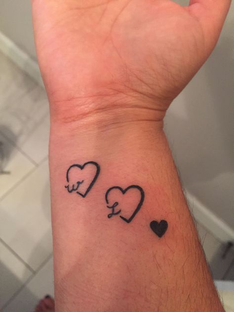 Small Heart Tattoo On Wrist Initials, Sister Tattoos3, L Heart Tattoo, Heart With Initial Tattoo, Heart Initial Tattoo, Simple Heart Tattoo Designs, Tattoos Family, Marriage Tattoos, Memorial Tattoo Ideas