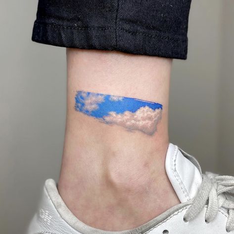 Cloud Tattoo Color, Paint Swatch Tattoo, Paint Smear Tattoo, Blue Sky Tattoo, Storm Clouds Tattoo, Sky Tattoos For Women, Pantone Tattoo, Leg Tattoo Designs For Women, Back Of Leg Tattoo