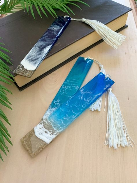 Bring home your own little piece of the ocean today with one of my handmade gorgeous beachy bookmarks. They feature two layers of pigmented resin to create depth and are made using REAL sand from my favorite local California beaches. All items are handmade with LOVE and make great gifts for those avid readers and beach lovers! Sea Bookmark, Ocean Bookmark, Beach Bookmark, Bookmark Resin, Acrylic Crafts, Resin Bookmarks, California Beaches, Beach Lover Gifts, Bookclub Gifts