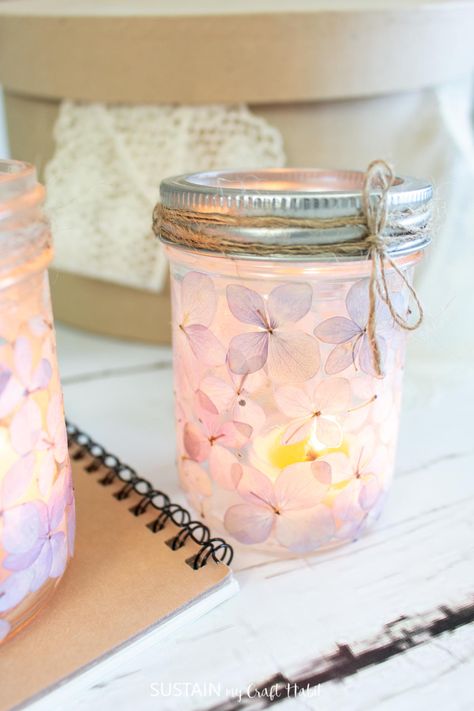 Add some romance to your space with pretty DIY mason jar luminaries made simply with pressed hydrangea blooms. Small Jar Crafts, Make Candle Holders, Pressed Hydrangea, Luminary Diy, Make Candle, Easy Mason Jar Crafts, Craft Spring, Jar Flowers, Mason Jar Luminaries