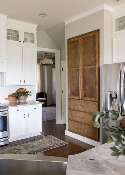 Side angled shot of the finished DIY pantry with a stainless steel refrigerator on the right and white cabinet to the left Cabinet Around Refrigerator, Pantry Closet Door, Floor To Ceiling Kitchen, Small Pantry Closet, Organizing Your Pantry, Pantry Renovation, Pantry Remodel, Pantry Closet, Diy Pantry