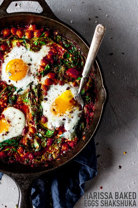 Bold Mediterranean flavors turn a simple shakshuka into something new and exciting when you whip up this harissa baked eggs recipe! With rich aromatics, savory chickpeas, spicy harissa and pepper flakes, this dish packs enormous flavor in mere minutes in a single skillet and is perfect for breakfast or dinner! From Minneapolis Food Blogger Karly Gomez | asimplepantry.com Skillet Ratatouille, Sumac Recipe, Recipe With Chickpeas, Minneapolis Food, Sumac Recipes, Harissa Recipes, Baked Eggs Recipe, Mediterranean Spices, Skillet Dishes