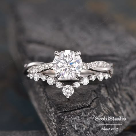 "White Gold Moissanite Engagement Ring Bridal Set Twist Infinity Solitaire Diamond Half Eternity Ring Bridal Women Promise Anniversary 2pcs Link for the main ring only: https://www.etsy.com/listing/623426001 Link for the same design with moonstone: https://www.etsy.com/listing/737678010/moonstone-bridal-set-white-gold?ref=shop_home_active_14&frs=1 ITEM INFORMATION Metal Type - Solid 14k Rose Gold Band Width - (approx. 2.3mm) Engagement Ring** Center Stone - 7mm Moissanite, Round Cut Clarity Wedding Bands For Infinity Rings, Twisted Engagement Rings With Wedding Band, Wedding Rings Engagement With Band, 3 Stone Engagement Rings With Band White Gold, Elegant Engagement Rings Set, Infinity Weeding Ring, White Gold Engagement Rings And Wedding Band, Wedding Bands For Women With Twisted Engagement Ring, Wedding Bands With Twist Engagement Ring