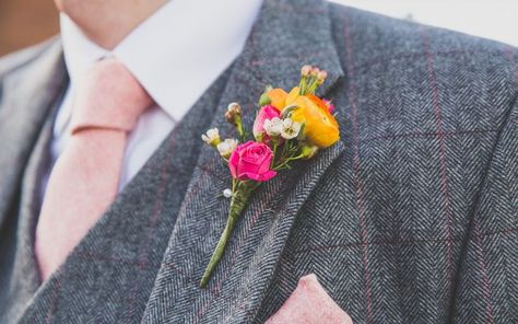 Pink and yellow bright button holes for your wedding party. Grey and pink wedding suit colour scheme. Pink Wedding Suit, Grey And Pink Wedding, Yellow Boutonniere, Bright Wedding Flowers, Button Holes Wedding, Unique Wedding Flowers, Boda Mexicana, Bright Wedding, Groom Boutonniere