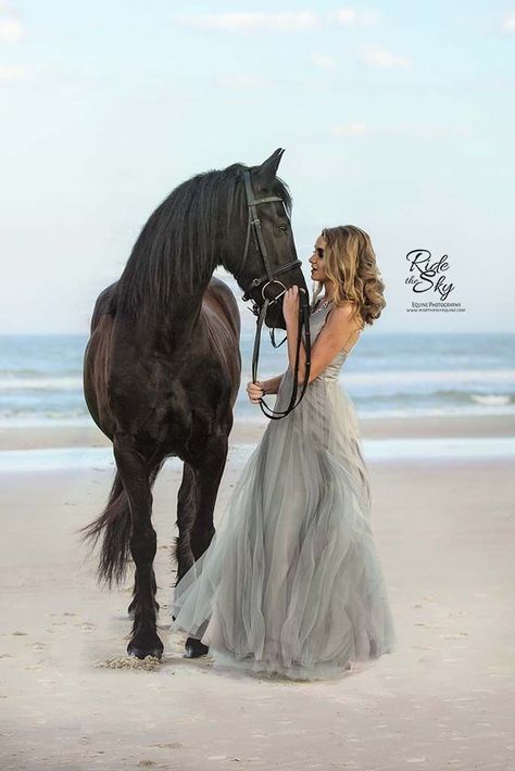 Girl in formal dress with Friesian horse photographed on the beach in Florida.  #girlandhorsephotography #equestrianphotographybeaches #equestrianphotographywater #equestrianphotographydreams #equestrianphotographyfashion #horsephotographyseniorpics #horsephotographysea #horsephotographyfriesian #horsephotographyportraits Photoshoot With Horse Dresses, Horse Beach Photoshoot, Photo With Horse Ideas, Photoshoot With Horse Ideas, Horse On Beach, Horses On The Beach, Horse Photoshoot Ideas, Equine Photography Poses, Horse Beach