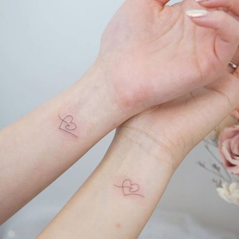 Minimalist heart and wave tattoo for best friends. Heart And Waves Tattoo, Matching Wave Tattoos Couples, Heart Tattoo For Best Friends, Best Friends Minimalist Tattoo, Wave With Heart Tattoo, Matching Wave Tattoos For Best Friends, Matching Water Tattoos, Wave And Heart Tattoo, Heart Best Friend Tattoos