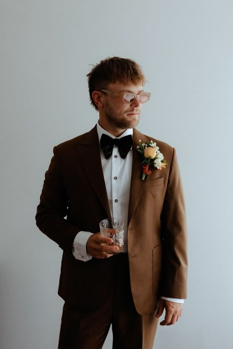 Grooms Suit Ideas Wedding, Colored Wedding Suits Men, Brown Suit Bow Tie, Brown Suit Ideas For Men, Brown Suit Groom And Groomsmen, Brown Tuxes Wedding, Brown Tuxedo Wedding Groomsmen, Mountain Wedding Mens Attire, Elopement Outfits Groom