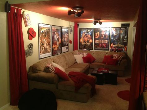 Our media room in the basement.  Ordered movie posters and red drape panels online, recovered pillows in funky red zebra print, and painted the ceiling red! Red Zebra Print, Basement Movie Room, Theater Room Decor, Movie Theater Rooms, Movie Room Decor, Home Theater Setup, Small Basements, Living Room Red, Home Theater Rooms