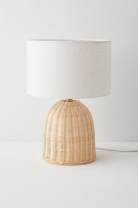 Infuse your space with coastal-meets-cottage flair with this boho table lamp. This table lamp features a dome-shaped base crafted from woven rattan that adds a natural warmth to your space. Topped with a tall, crisp woven drum shade for a chic finish. Features Boho-chic rattan table lamp Plug in Push-through socket switch Compact fluorescent compatible Requires one E26 60W bulb - not included Content + Care 39.6% Rattan, 28.9% packaging, 17.2% fabric, 7.3% electronics, 7% metal Wipe clean Imported Made in compliance with US electrical standards. To use this item outside of the US, pair with an outlet adapter and voltage converter made specifically for use in your location. Size Wattage/Voltage: 60W/120V Dimensions: 12.5" l x 12.5" w x 18.25" h Base dimensions: 7.75" dia x 9" h Shade dimens Boho Desk Lamp, Neutral Lamp, Boho Table Lamp, Neutral Lamps, Rattan Table Lamp, Wicker Lamp, Boho Lamp, Boho Table, Rattan Table