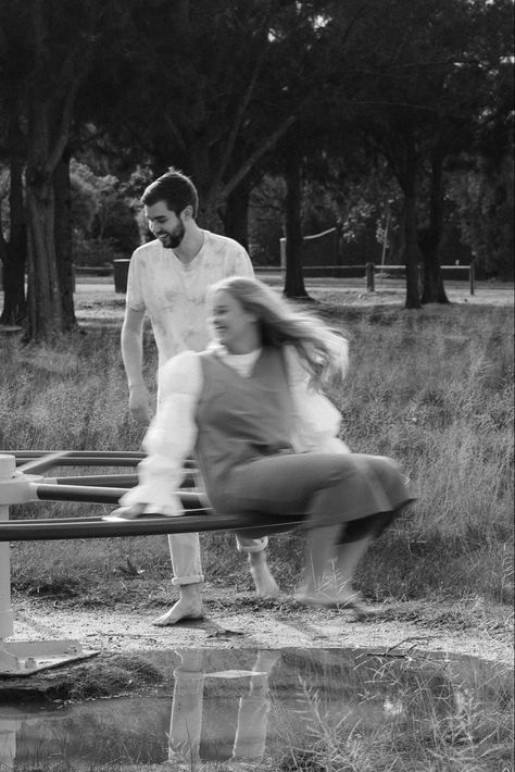 A couple on a merry-go-round Playground Photoshoot, Playground Photo Shoot, Playground Photography, Playground Pictures, Wood Playground, Anniversary Photoshoot, Shoot Film, Park Photos, Anniversary Photos