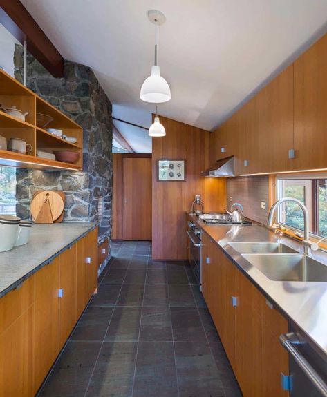 Mid-Century modern home in New England with a nature backdrop Galley Kitchens Ideas, Galley Kitchen Renovation, Galley Kitchen Remodel Ideas, Modern Mid Century Kitchen, Mid Century Kitchen Remodel, Scandinavian House, Galley Kitchen Remodel, Galley Kitchens, Mid Century Modern Kitchen