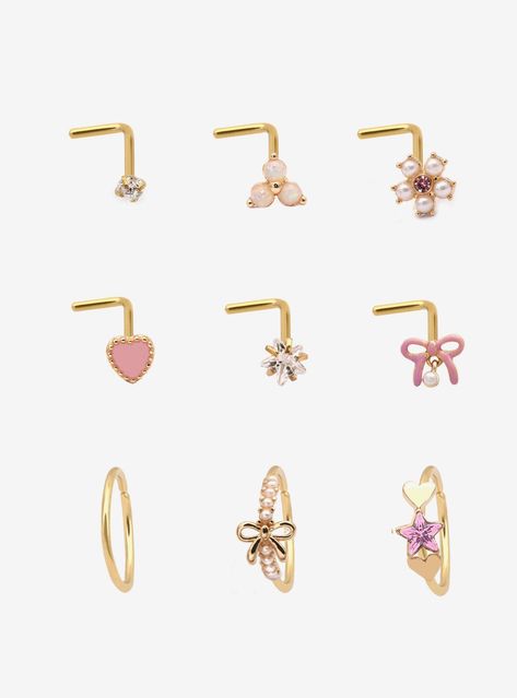 Gold-tone set including 6 nose studs and 3 nose hoops with pink heart  bow  star and flower designs. Plus  opalescent  faux pearl and pink gem detailing.Jewelry care: Wash with antibacterial soap and warm water.Piercing care: Wash hands thoroughly  then clean piercing with H2Ocean (sold separately) or saline solution.316L surgical steel Nickel-free2mm - 7.5mm designsSet of 9Use in healed piercings only. Remove immediately if irritation occurs. Do not use harsh or alcohol-based che Bow Nose Piercing, Cute Nose Jewelry, Cute Nose Piercing Jewelry, Faith Piercing, Cute Piercings Nose, Pink Piercings, Nose Ring Aesthetic, Cute Nose Studs, Heart Nose Stud