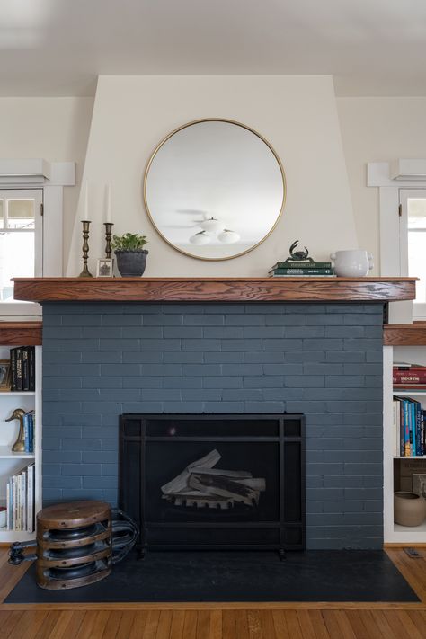 Painted brick fireplace Navy Fireplace Brick, Dark Blue Brick Fireplace, Navy Blue Brick Fireplace, Tudor Revival Fireplace, Fireplace Colors Painted, Green Painted Fireplace, Painted Brick Chimney, Blue Painted Fireplace, Navy Blue Fireplace