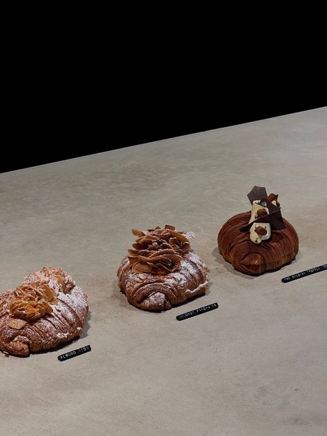 Freshly baked croissants in bakery, very minimalistic sitting on a stone bench Minimalist Food, Almond Chocolate, French Aesthetic, Bakery Branding, French Bakery, Fast Casual, Bakery Design, Aesthetic Minimalist, Bakery Business